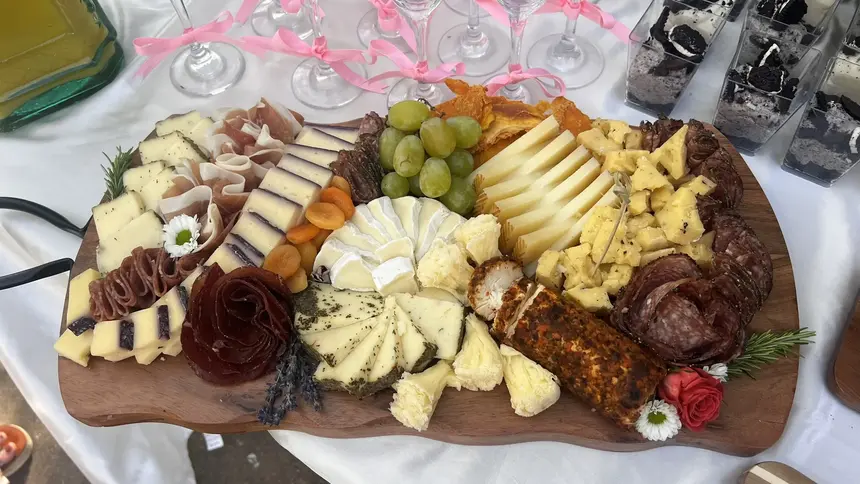 Charcuterie board with dessert accents and fruit